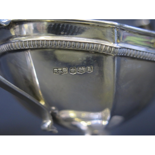 693 - A George V silver twin handled sugar basin, maker Roberts & Belk, 1918, of oval outline, raised on a... 