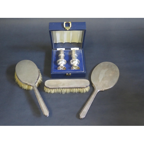 701 - A George VI three-piece dressing table set, maker Mappin & Webb, London, 1942, with engine turned de... 