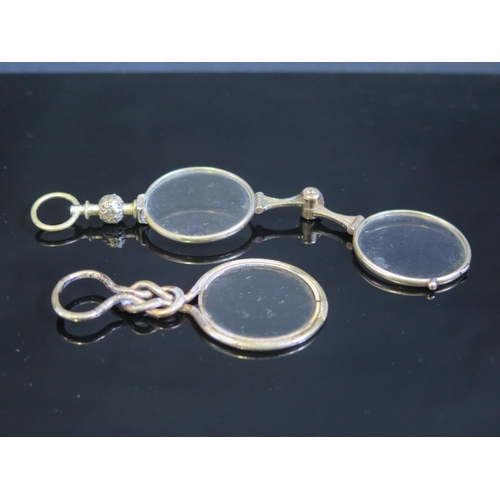 706 - A pair of 19th century gilt metal framed lorgnettes, together with a gilt metal framed monocle. (2).