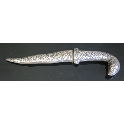 709 - A Persian dagger, with 9cm wavy Damascus blade, with silver and niello enamel handle with goat's hea... 