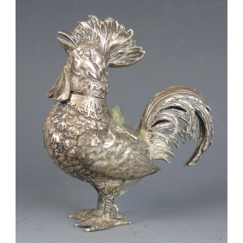 721 - A continental silver pepperette in the form of a cockerel, bears import marks, (one wing loose, the ... 