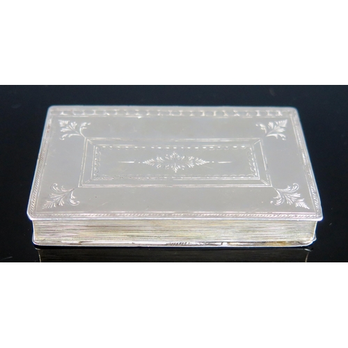 722 - A silver snuff box in the form of a book, unmarked, the hinged lid enclosing a gilded interior, 7.5c... 