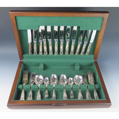 734 - A plated Kings pattern flatware service, six setting, contained in a mahogany canteen.