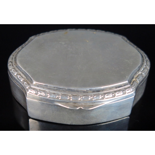 744 - A continental snuff box, stamped marks of cartouche-shaped outline, the hinged lid enclosing a gilt ... 