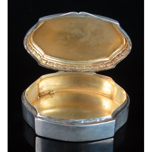 744 - A continental snuff box, stamped marks of cartouche-shaped outline, the hinged lid enclosing a gilt ... 