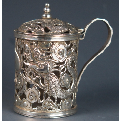 745 - A Chinese silver mustard pot and cover, maker WA, with hinged domed lid and pierced dragon decoratio... 