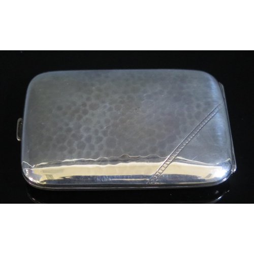 751 - A continental hammered silver cigarette case, stamped marks, of rectangular outline, 9cm wide, 68gms... 