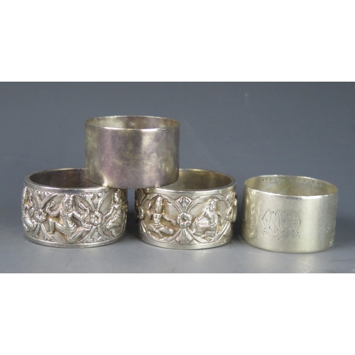 755 - Four Indian silver napkin rings, two marked Madras, total weight of silver 117gms, 3.75ozs.