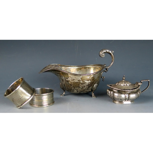 769 - A mixed collection of silver wares, various makers and dates, includes, sauce boat, two napkin rings... 