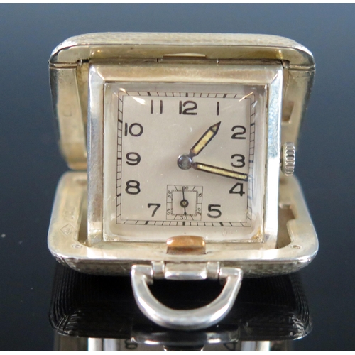 771 - A George V silver cased travelling timepiece, maker SSM, Birmingham, 1935, with 2.25cm Arabic dial w... 