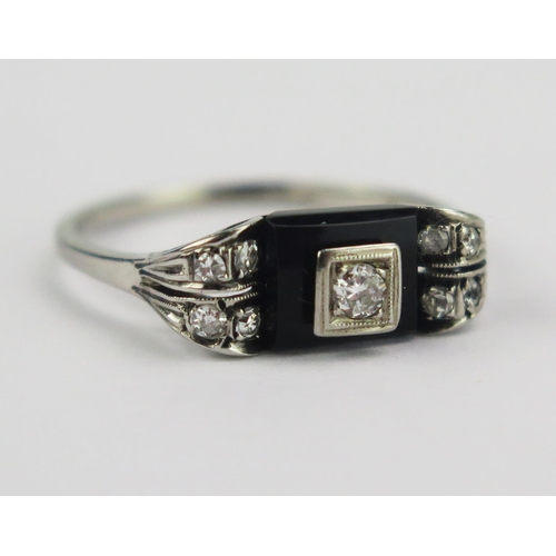 78 - A French Deco 14ct White Gold, Diamond and Onyx Ring, c. 2.5mm principal stone, various marks and st... 