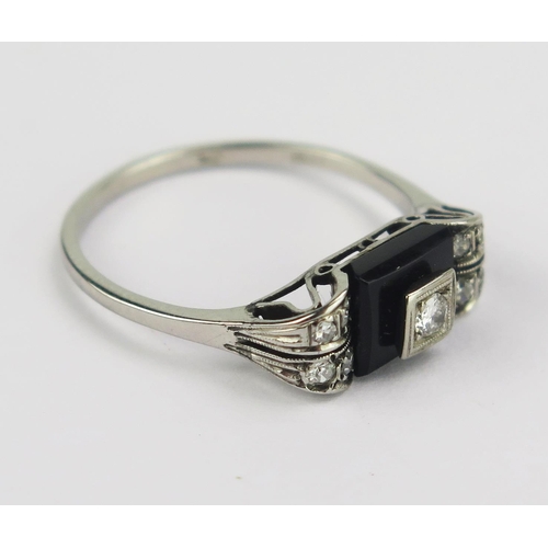 78 - A French Deco 14ct White Gold, Diamond and Onyx Ring, c. 2.5mm principal stone, various marks and st... 