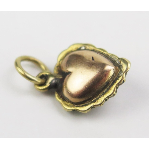 80 - A 19th Century Enamel and Pearl or Cultured Pearl Heart Shaped Pendant in a precious yellow metal se... 