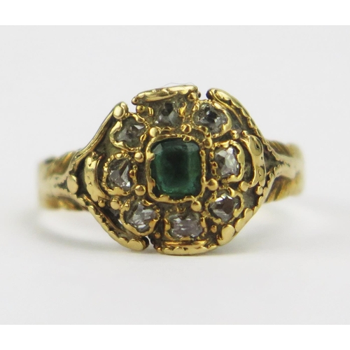 83 - An Early 19th Century Emerald and Diamond Cluster Ring with chased decoration to the shank, 9.6mm he... 