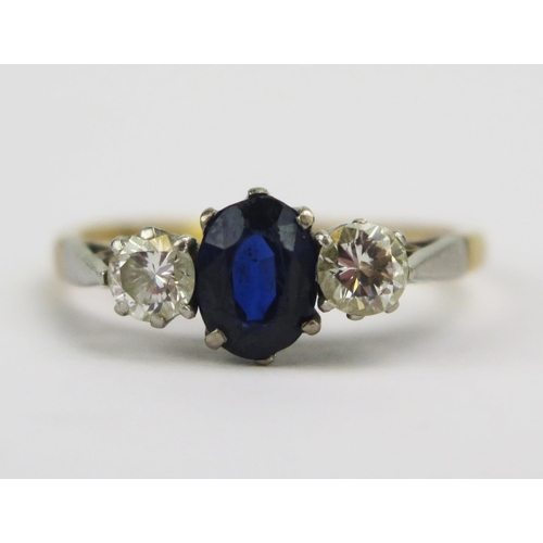 85 - An 18ct Gold, Sapphire and Diamond Three Stone Platinum Set Ring, 6.8x5.2mm principal stone with, 4.... 