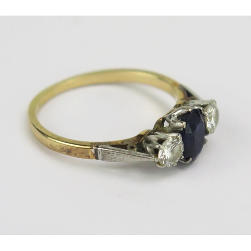 85 - An 18ct Gold, Sapphire and Diamond Three Stone Platinum Set Ring, 6.8x5.2mm principal stone with, 4.... 