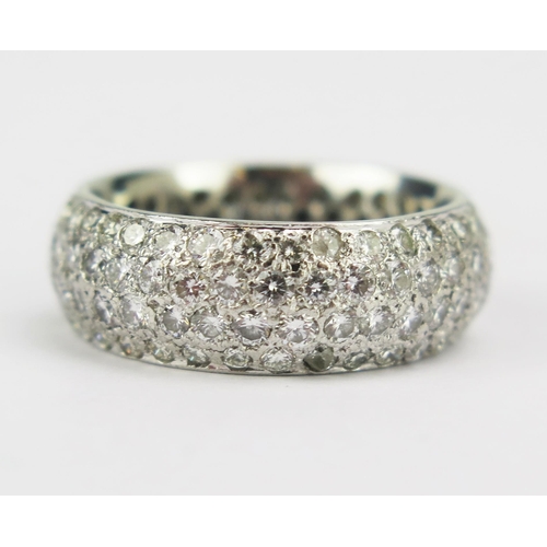 86 - A Diamond Four Row Band in a precious white metal setting (platinum or 18ct), 7.5mm wide, 11.31g