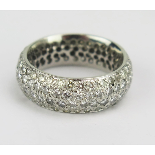 86 - A Diamond Four Row Band in a precious white metal setting (platinum or 18ct), 7.5mm wide, 11.31g