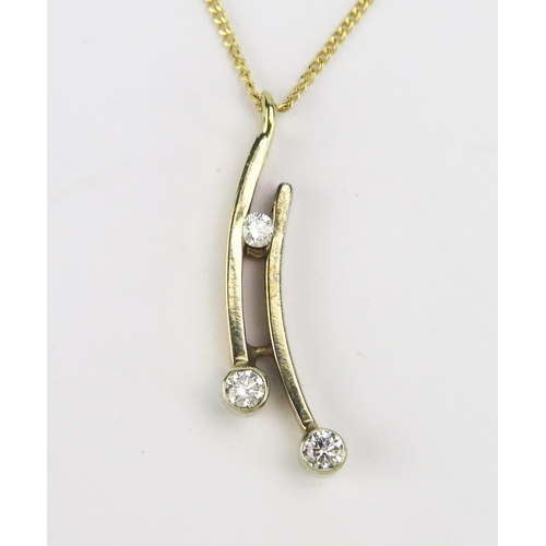 88 - A Yellow and White Gold and Diamond Pendant on chain, c. 2.7mm principal stones, 29mm drop and on an... 