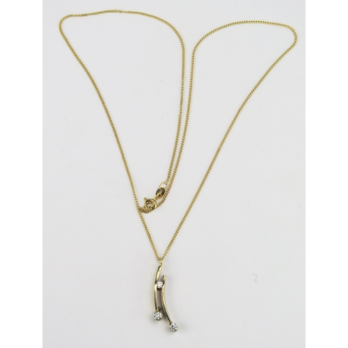 88 - A Yellow and White Gold and Diamond Pendant on chain, c. 2.7mm principal stones, 29mm drop and on an... 