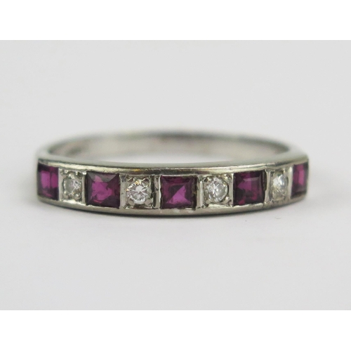 91 - An 18ct White Gold, Ruby and Diamond Half Eternity Ring, 4mm wide band, stamped 18CT, maker G&S, U.5... 