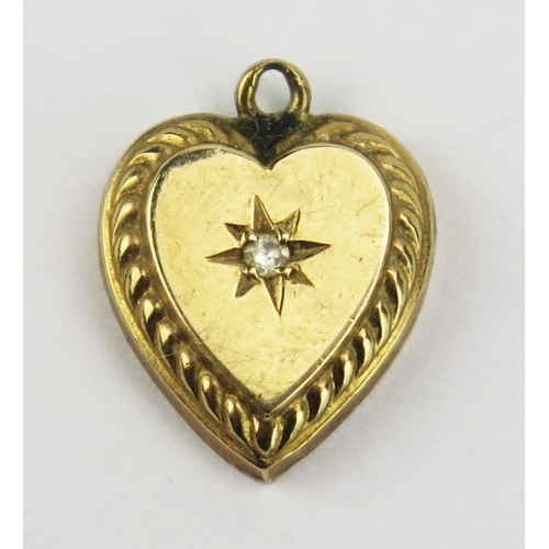 92 - A Precious Yellow and Diamond Heart Shaped Pendant, 12.6mm drop, KEE tested as 9ct, .79g
UNLESS OTHE... 