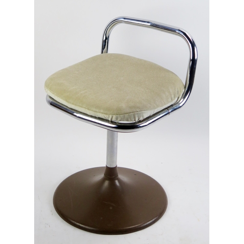 1074A - A 1970's Chair Centre tubular chrome swivel low chair, with padded seat on a circular base.