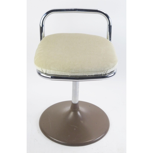 1074A - A 1970's Chair Centre tubular chrome swivel low chair, with padded seat on a circular base.