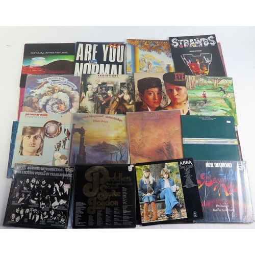 1123A - A collection of 45 and 33rpm LP's by various artists including, Moody Blues, Beatles, Rolling Stones... 