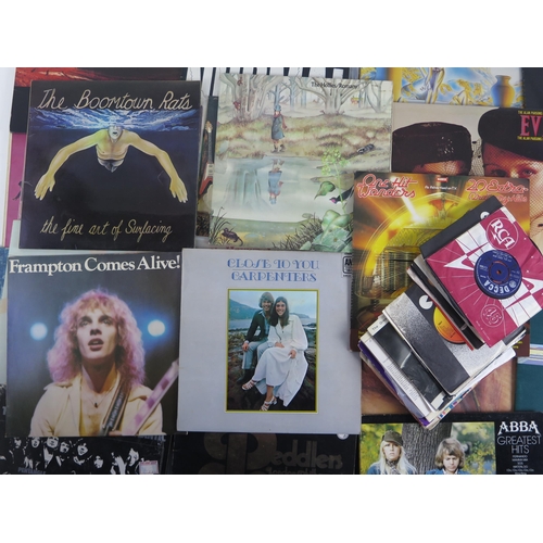 1123A - A collection of 45 and 33rpm LP's by various artists including, Moody Blues, Beatles, Rolling Stones... 