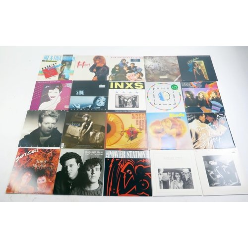 1123B - A collection of45 and 33rpm records and LP's, artists include Tears for Fears, Duran Duran, Blondie.... 