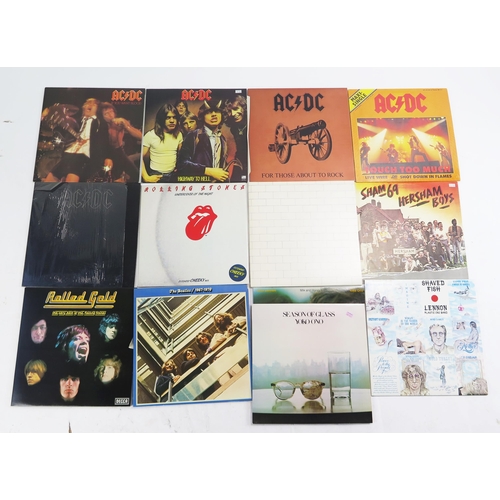 1123D - A small selection of 33rpm LP's, artists include AC/DC, The Beatles, Rolling Stones, Sham 69.