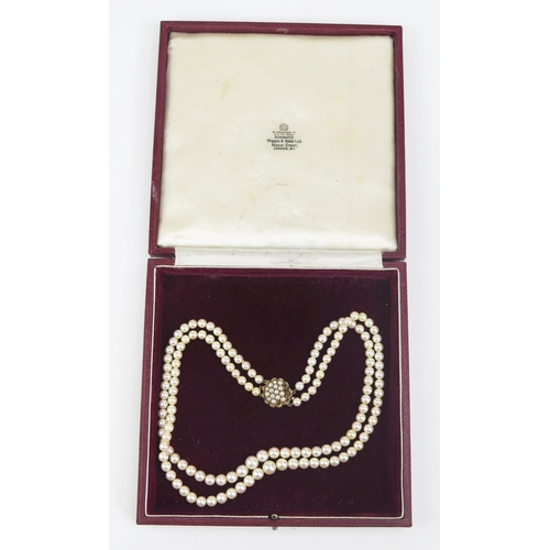 131 - A Graduated Pearl or Cultured Pearl Twin Strand Necklace with 9ct clasp, 17.25