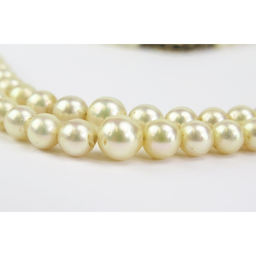 131 - A Graduated Pearl or Cultured Pearl Twin Strand Necklace with 9ct clasp, 17.25