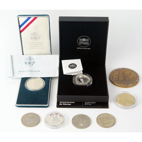 1440A - A 10 Euro proof coin, a 1990 American proof silver dollar, commemorative crowns. and medallions.