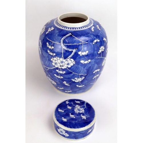 1530 - A Kangxi blue and white jar and cover, of ovoid form, with all-over prunus decoration, bears four ch... 