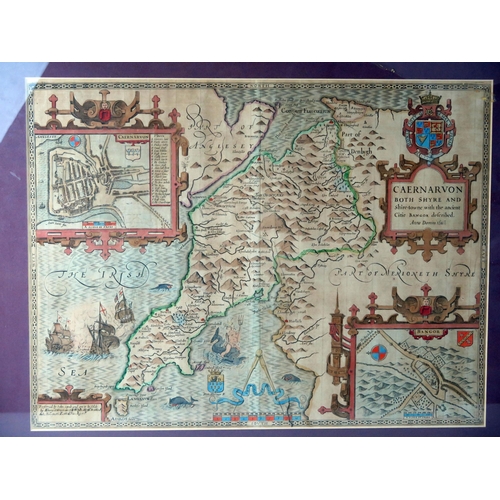 1610B - After John Speede, a hand coloured engraved map of Caernarvon, with vignettes of Caernarvon and Bang... 