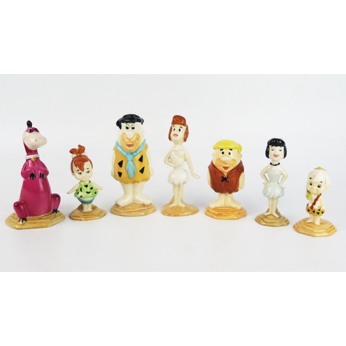 1668 - A collection of Beswick Flintstones figures Fred and Wilma, Pebbles Flintstone, Barney and Betty, Ba... 