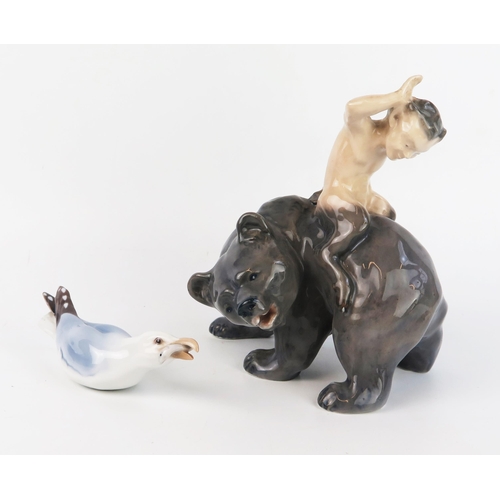 1671 - A Royal Copenhagen porcelain model of a satyr riding on the back of a bear, model No 976, 19cm high,... 