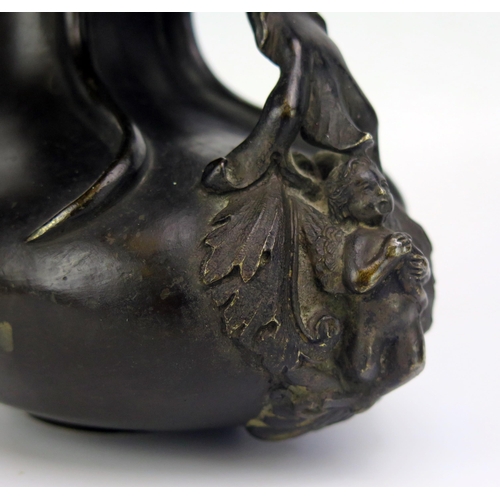 1683 - A 19th century bronze jug, of gourd shape outline the rim surmounted by two goats, with scroll handl... 