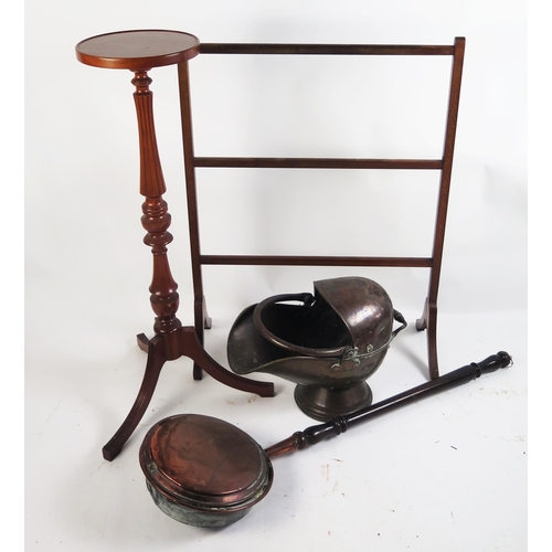 1692 - A copper coal scuttle of helmet outline, together with a copper warming pan with ring turned handle.... 