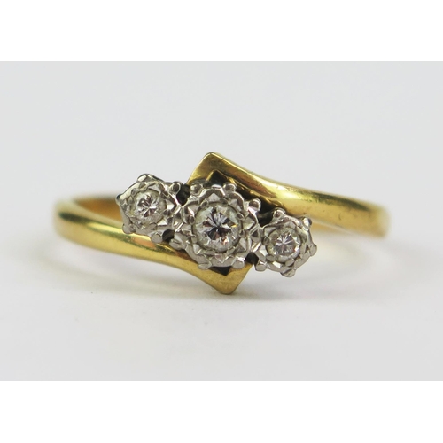 189 - A Diamond Three Stone Crossover Ring in a precious yellow and white metal setting, size Q.5, KEE tes... 