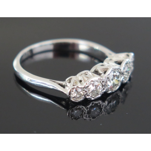 270 - A Diamond Five Stone Ring in a precious white metal setting,  c. 4.3mm principal illusion set stone,... 