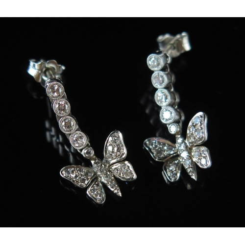 276 - A Pair of Diamond Butterfly Pendant Earrings in a precious white metal setting, with four articulate... 