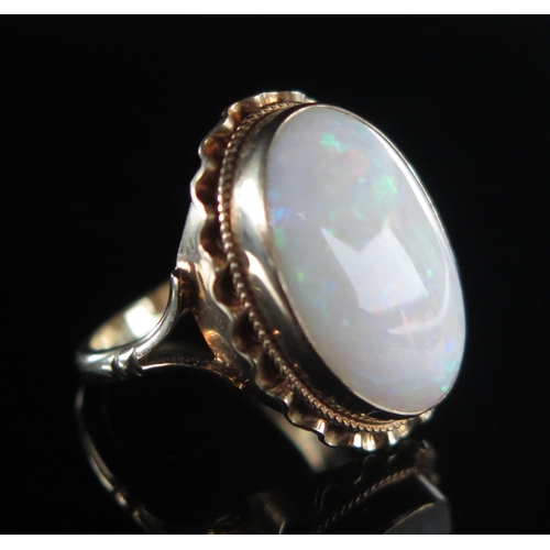 279 - A 9ct Gold and Opal Dress Ring, 17.6x12.1mm singlet specimen, size L, hallmarked, 4g