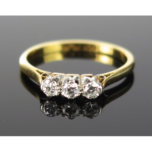 308 - An 18ct Gold and Diamond Five Stone Ring, c. 2.9mm principal rub over set stone, size N.5, stamped 1... 