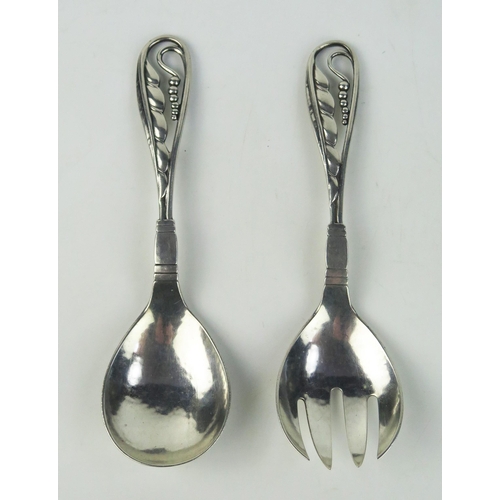 674 - A pair of Georg Jensen silver pattern 42 serving spoons, bears import marks, 15cm long, 74.4gms, 2.3... 