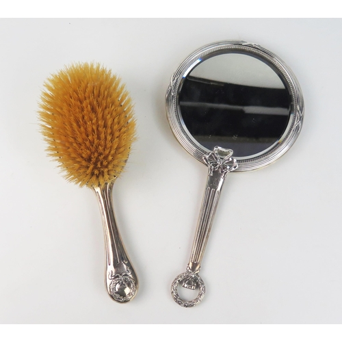 775 - An Edward VII silver and tortoiseshell backed hand mirror and hairbrush, maker Levi & Salaman, Birmi... 