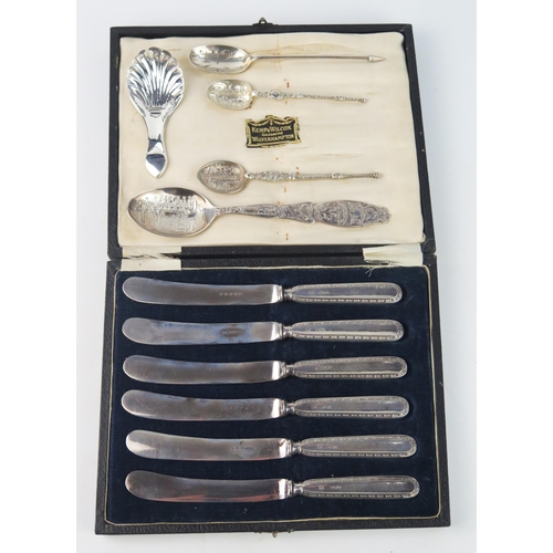 777 - A set of six silver handled butter knives, filled, cased, a late Victorian silver caddy spoon, and E... 