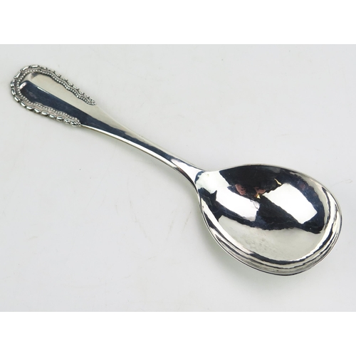 784 - A Georg Jensen silver serving spoon, bears import marks for London, 1930, 20cm long, 85gms, 2.76ozs